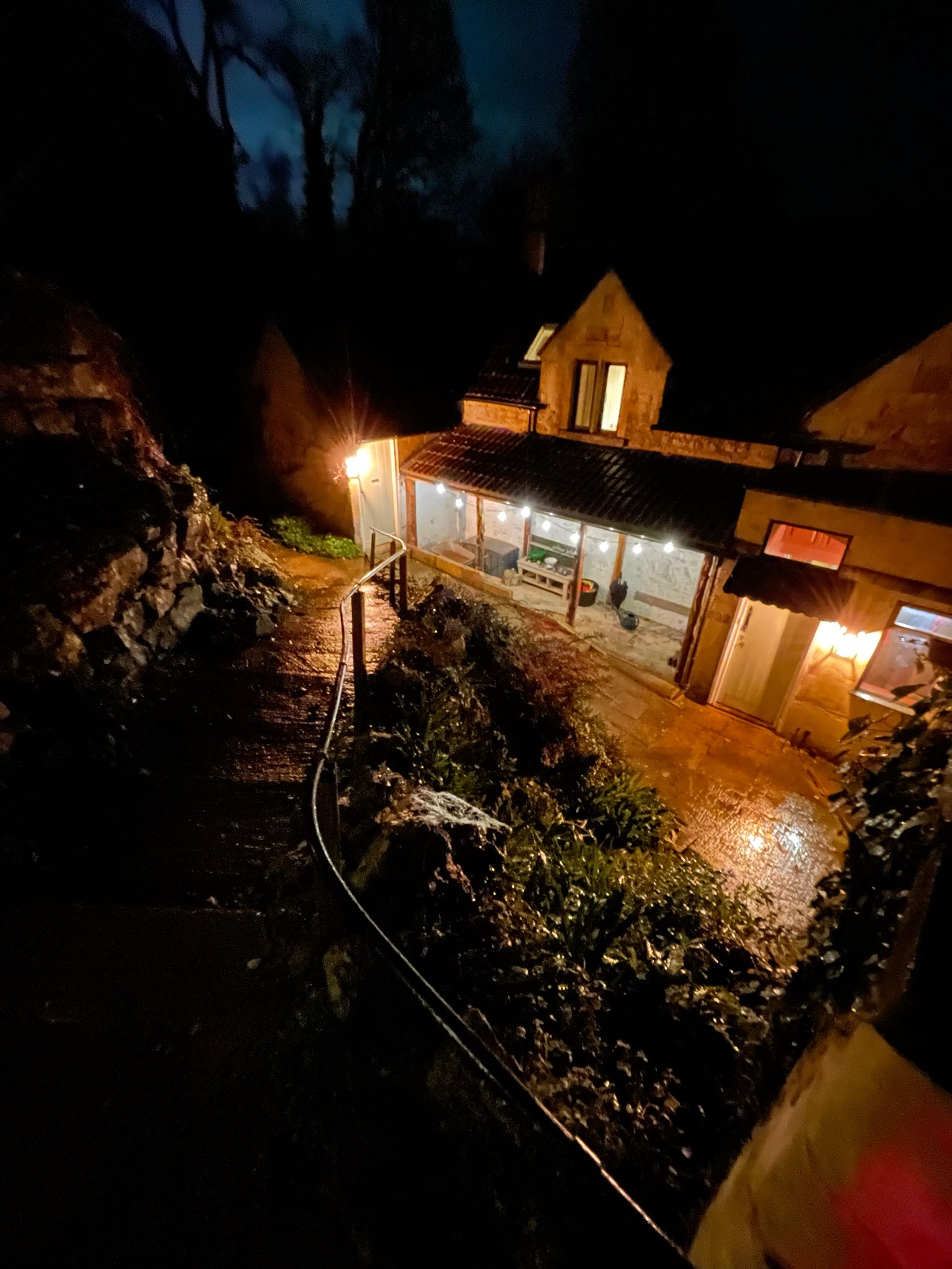 Cottage exterior lighting with festoon and wall lights