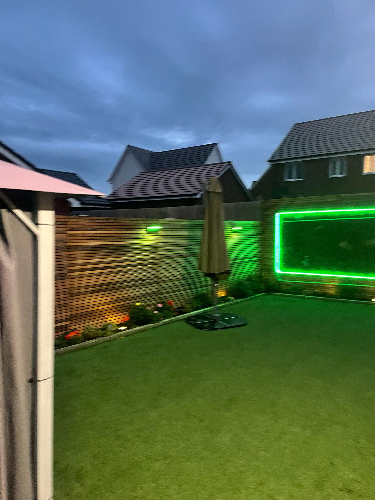 Garden with RGB LED neon border light and fence uplights