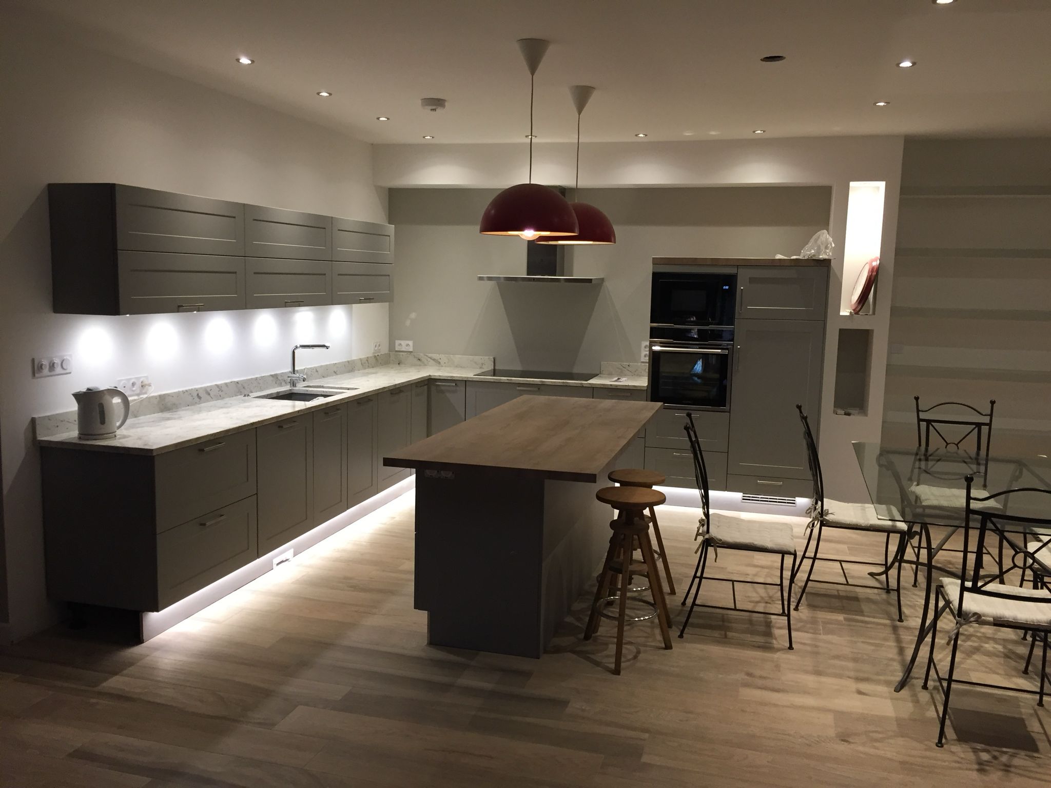 Modern kitchen with under-cabinet, pendant and kickboard lighting